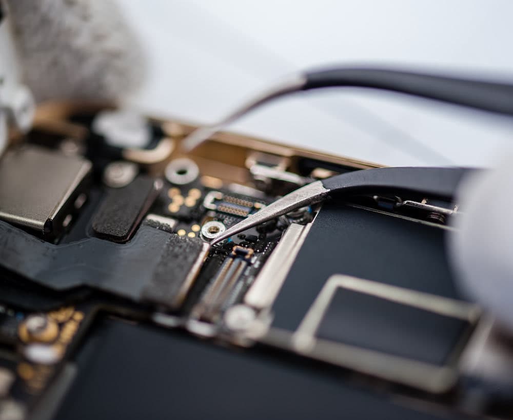Technician repairing a phone